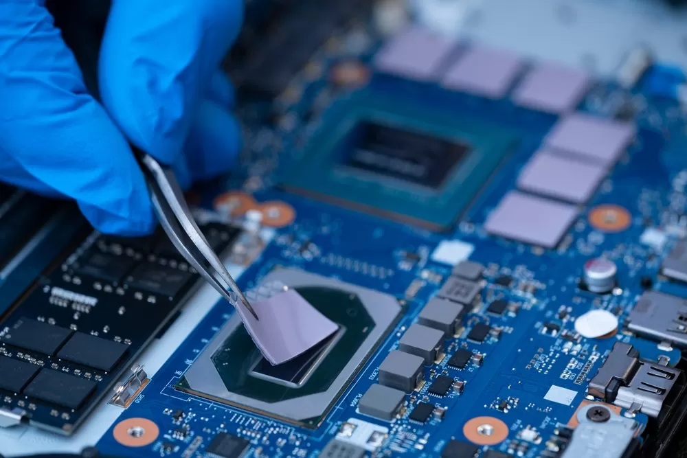 Technician Repairing Inside of Thermal Pad for IC